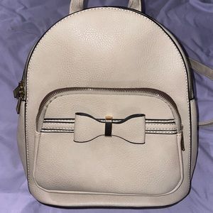 Faux leather, bow backpack.